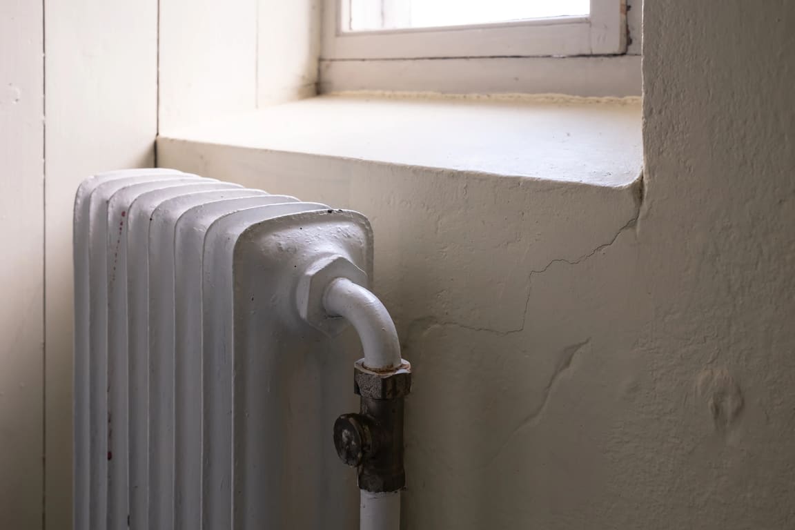 Cast-iron radiator under an old window